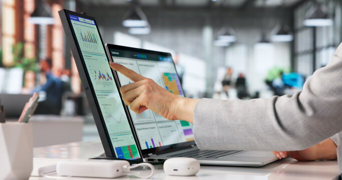 Financial Analyst Reviewing Digital Data On Laptop Screen