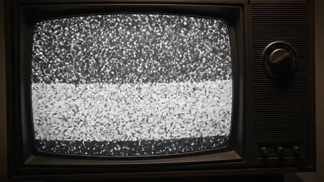 Vintage television displaying static noise on its screen