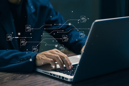 Businessman working on laptop with digital workflow automation system, document processing, data management, business efficiency, productivity tools and process optimization concept.