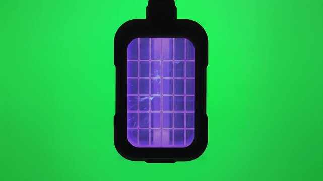 Pulsating battery icon with vibrant purple energy grid and dynamic electric discharge on green screen background, symbolizing power and energy, representing technology and innovation