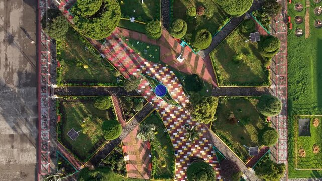 aerial zoom out and top down view shot above the colorful geometric park in murillo, tolima near nevado del ruiz volcano