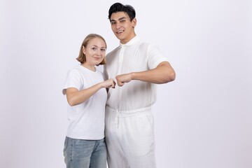 Fototapeta premium Happy young couple showing heart gesture