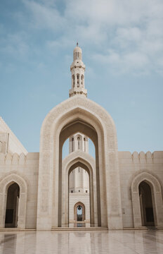 Massive arch and minaret at Grand Mosque in Muscat, Oman