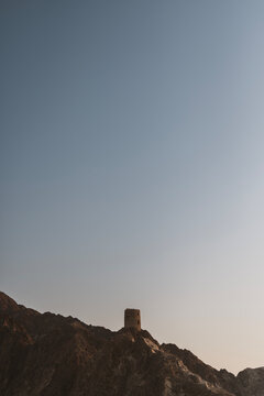 Ancient watchtower sits on mountain near Muscat, Oman