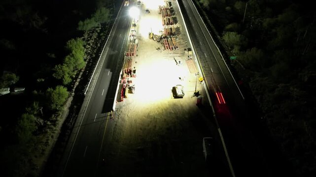 Night Drone Hyperlapse of Highway Bridge Pillars and Infrastructure Staging