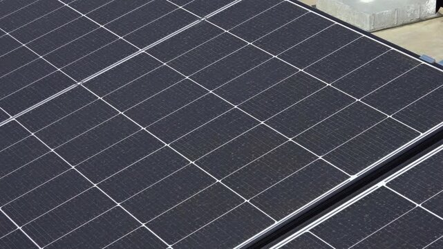 Solar panels on the roofs of older apartment buildings. A rooftop solar power plant. Solar panels on the roof of an apartment building. 