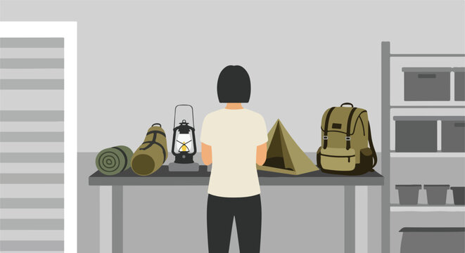 Person prepares for outdoor adventure with camping gear organized