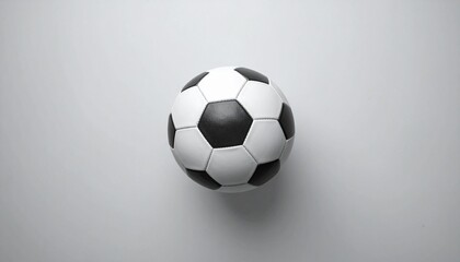Fototapeta premium Classic Soccer Ball on Simple Background Depicting Team Sports and Athletic Activities.