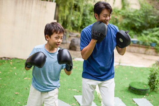 Father-son boxing lesson