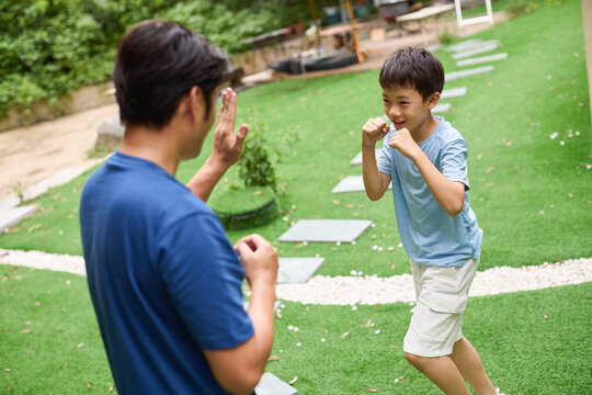 Father-son boxing lesson
