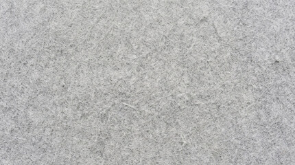 Fototapeta premium Very light silver-grey felt texture close-up. Fine fibrous surface with minimal texture variation. Perfect for soft, airy, and minimalist design backgrounds.