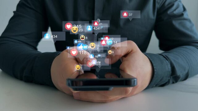 Interactive with friends on chat with emoticon feedback.Social media,marketing, like,social network,blog,live,chat reaction and livestream.Person using smart phone with emoticon icons of Social Media.