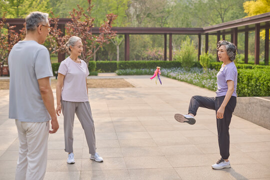 Seniors playing shuttlecock in a park