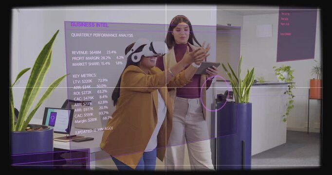 Headset user reaching and tablet user tapping, adjusting BUSINESS INTEL hologram, reviewing revenue