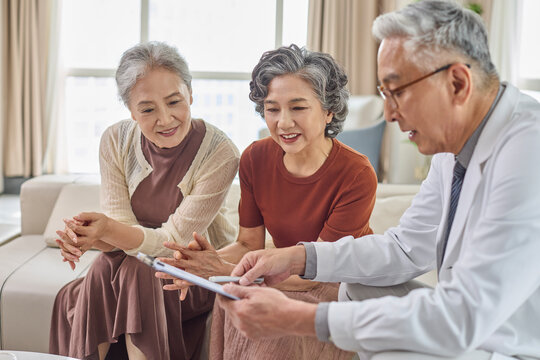 Seniors meeting with their doctor at the nursing home