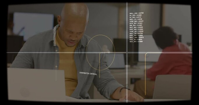 Office worker reacting to OVERWATCH CRITICAL alert, checking papers and asking colleague for help