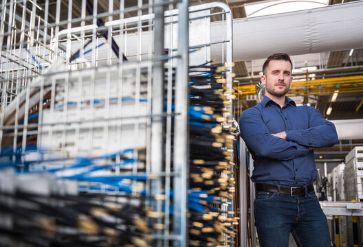 Portrait of confident businessman in factory shop floor