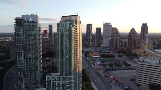 Aerial view of downtown Mississauga, Ontario, Canada along Burnhamthorpe Road looking west towards City Centre, including the Mall, City Hall, condominium buildings and Celebration Square. Moving down