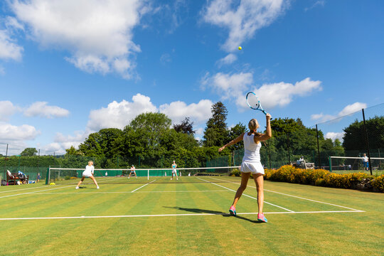 Mature women during a tennis match on grass court