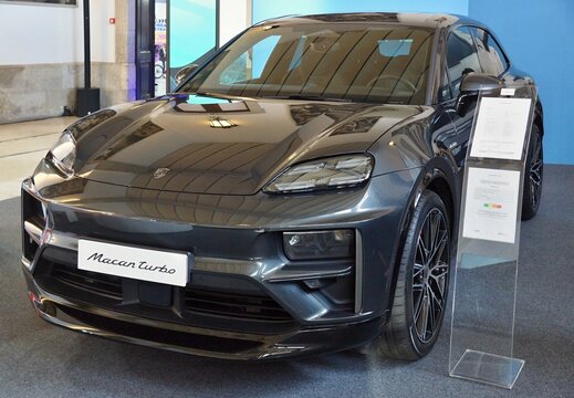 Modern dark grey Porsche Macan Turbo electric SUV