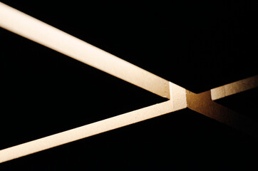 Minimalist Geometric Intersect: Light and Shadow Abstract. Conceptual Architectural Composition with Warm Tonal Contrast and High-End Negative Space Background. © Aaron Lee
