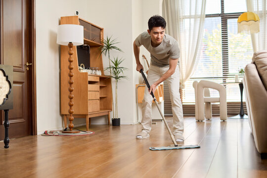 A stay-at-home dad busy with the household chores