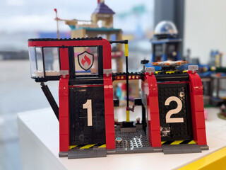 Naklejka premium Red toy fire station with numbered doors