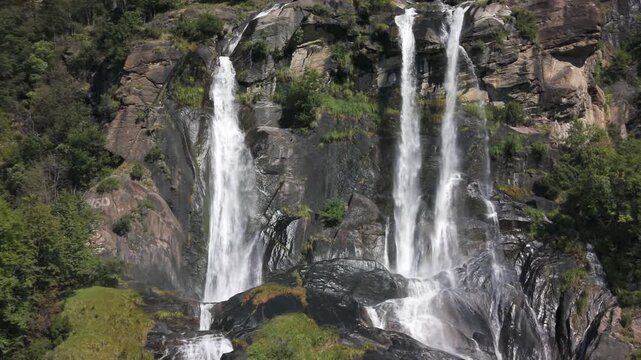 Powerful Acquafraggia waterfalls cascading over rocks in Val Bregaglia, Lombardy, Italy. Aerial