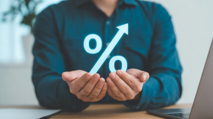 Businessman presenting a growing percentage sign with hands on a desk in an office