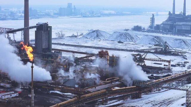 Zug Island in River Rogue, Michigan, USA - coke furnace for steel operated by DTE, one of the most polluted spots in the US - flare (fire) burning