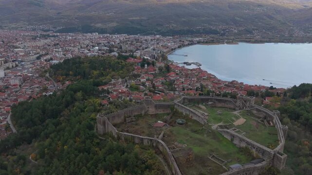 Aerial footage of Tsar Samuel&rsquo;s Fortress in Ohrid, gradually revealing the old town below, showcasing medieval architecture, historic landmarks, and scenic Balkan landscapes.