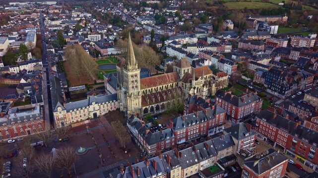 Drone aerial view of Saint Peter Cathedral surrounded by historic buildings and city center of Lisieux in Normandy France.