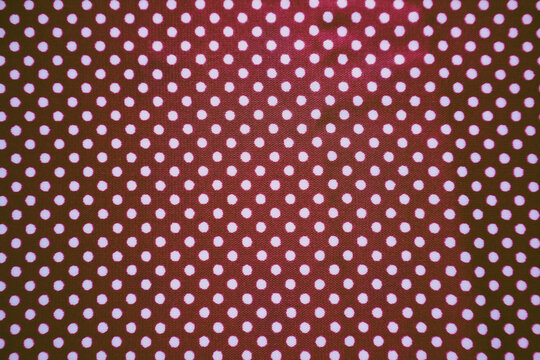 Purple fabric texture with white polka dot pattern background