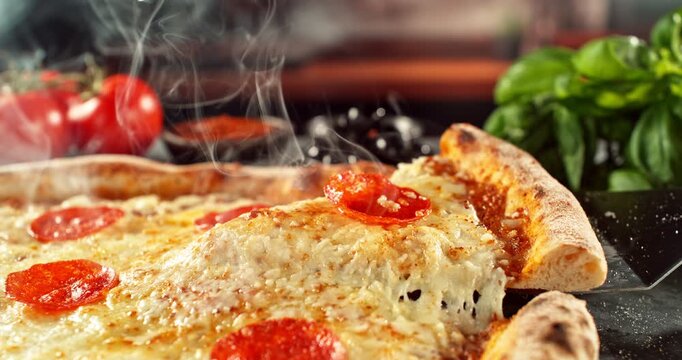 Super slow motion footage (1000 fps) of a pizza slice being lifted with perfectly melted, stretchy cheese. Rich textures of crust, salami, tomato and fresh basil in cinematic light.