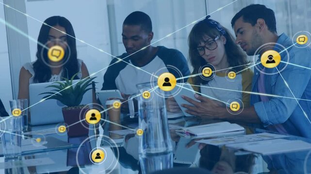 Team using laptop tablet as network icon appearing above phone driving growing web for business