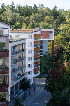 Modern residential apartment building architecture along quiet street with trees in sustainable Stockholm Sweden Norra Djurgardsstaden district