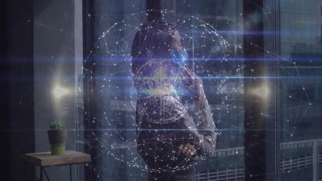 Woman standing by window calling phone touching mask holo globe pulsing around her managing biz net