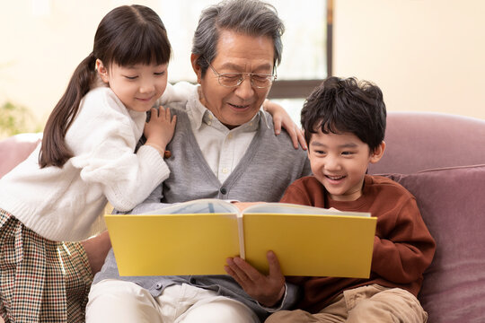 Story time with Grandpa on the couch