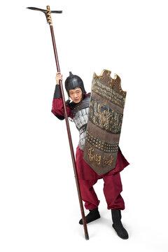 Humorous studio shot: armored ancient soldier