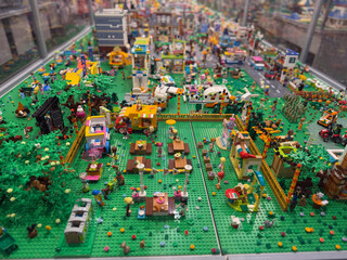 Naklejka premium Colorful lego park diorama in glass display case