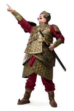 A fully armored general pointing and laughing