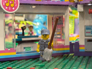 Naklejka premium Lego janitor minifigure with mop