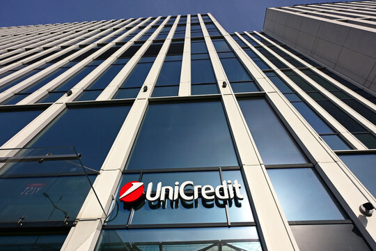 Ł&oacute;dź, Lodz, Poland, Europe - 02.2026 : Logo of UniCredit Bank - Italian multinational banking group, Hampton by Hilton Hotel in Hi Piotrkowska skyscraper, seen from Mickiewicz Avenue