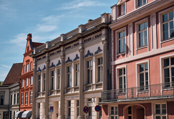 Fototapeta premium European Architecture And Urban Heritage Row Of Historic Buildings In Stralsund Germany Ornate Facades Balconies And Architectural Details Under A Sunny