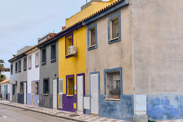 Obraz premium Urban Renewal And Colorful Architecture Row Of Renovated Townhouses In La Linea De La Concepcion Andalucia Spain Showing Community Development And Real Estate Investment