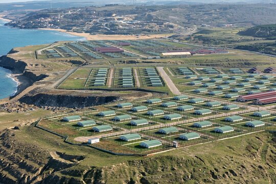 Aerial view animal shelter stretch across the landscape near the coast, where the sea meets the shore, Istanbul, Istanbul, Turkey.