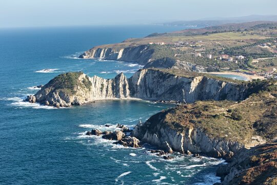 Aerial view of the rugged coastline where the dark blue sea meets the light-colored cliffs, Istanbul, Istanbul, Turkey.