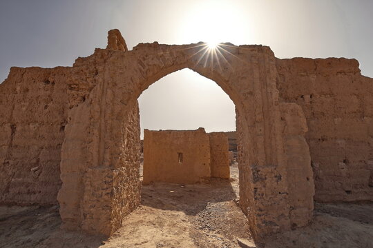 Sunstar cast over the adobe brick remains, plastered with rammed earth (pis&eacute;) and mud, of a former French Foreign Legion fort. Ksar Guedim-Morocco-170