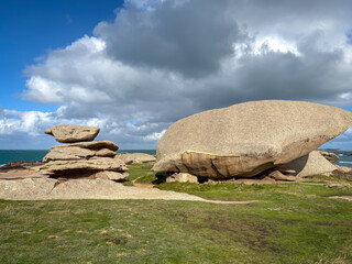 Balanced granite stacks beside large boulder in Tregastel Brittany France © daboost