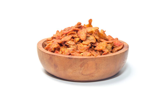 top-down perspective of the spicy fried anchovies served neatly inside a rustic wooden bowl.
